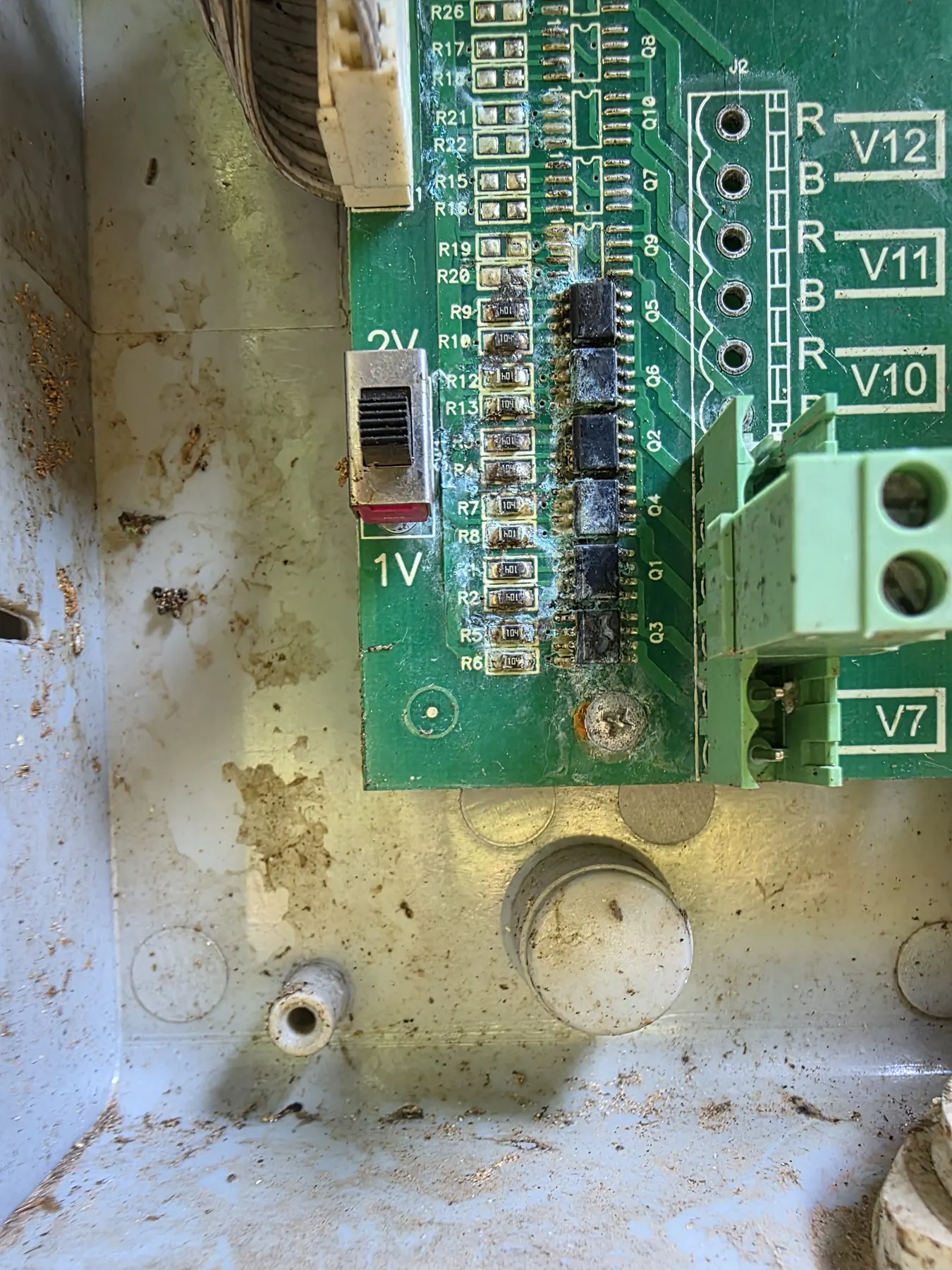 Close-up detail of internal corrosion in the irrigation computer